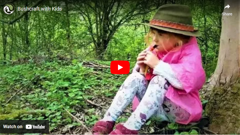 youtube art, young girl dressed in pink with leggings and trilby style hat playing a wooden flute