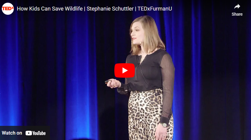 lady speaker giving a TED talk