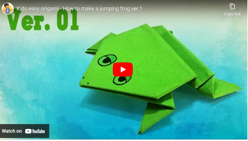 folded paper green frog that jumps